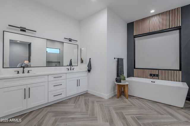 33766 N 86th St, Scottsdale, AZ 85266 - bathroom with baseboards, a freestanding tub, double vanity, recessed lighting, and a shower