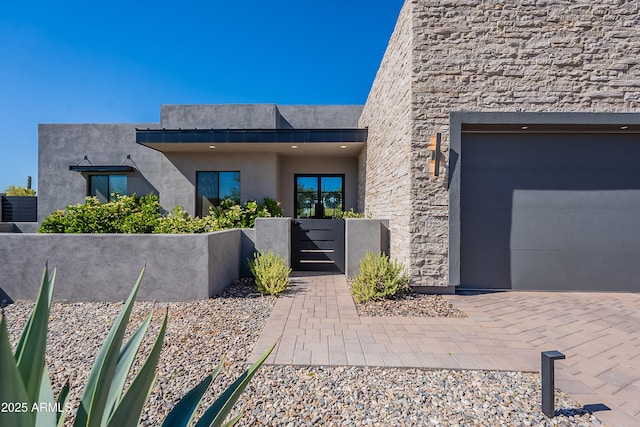 33766 N 86th St, Scottsdale, AZ 85266 - view of front facade featuring stone siding, stucco siding, and a garage