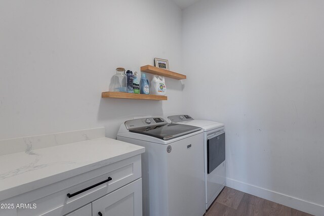33766 N 86th St, Scottsdale, AZ 85266 - clothes washing area featuring washing machine and dryer, dark wood-style flooring, cabinet space, and baseboards