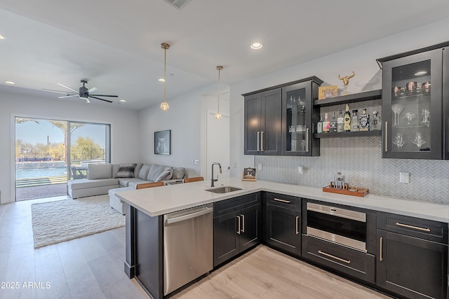 33766 N 86th St, Scottsdale, AZ 85266 - kitchen with dishwasher, a sink, backsplash, light wood-type flooring, and recessed lighting