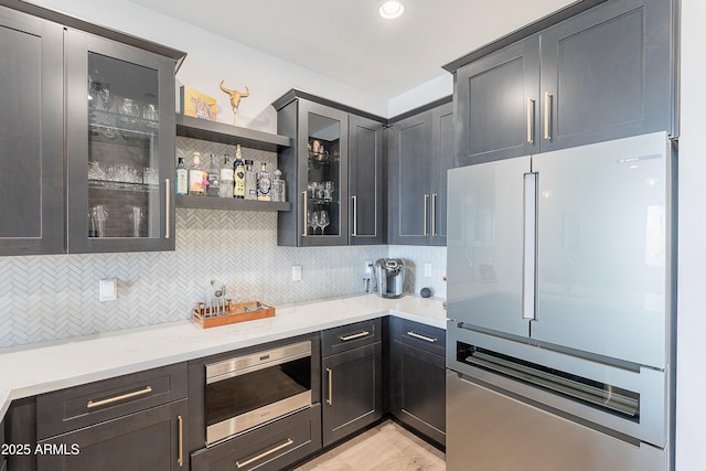 33766 N 86th St, Scottsdale, AZ 85266 - indoor wet bar with freestanding refrigerator, stainless steel microwave, and tasteful backsplash