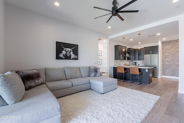 33766 N 86th St, Scottsdale, AZ 85266 - living room with light wood finished floors, ceiling fan, recessed lighting, and baseboards