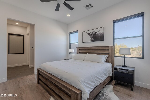 33766 N 86th St, Scottsdale, AZ 85266 - bedroom with baseboards, light wood-style floors, recessed lighting, and a ceiling fan
