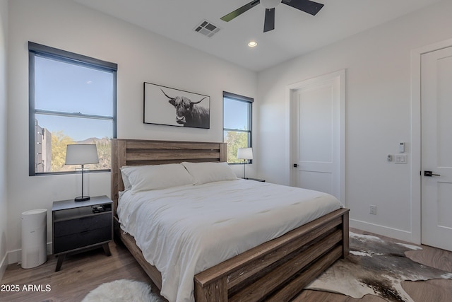 33766 N 86th St, Scottsdale, AZ 85266 - bedroom with baseboards, wood finished floors, ceiling fan, and recessed lighting