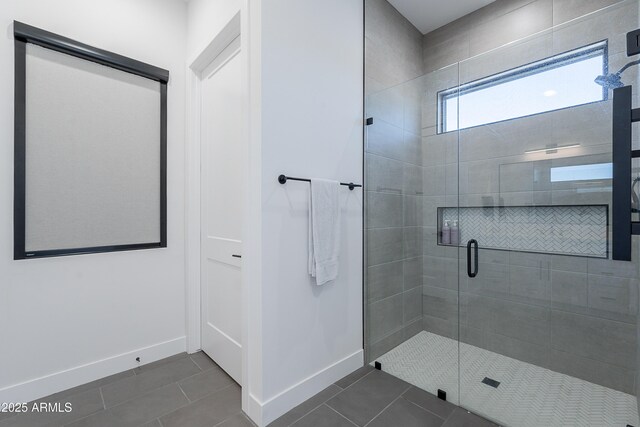 33766 N 86th St, Scottsdale, AZ 85266 - bathroom featuring tile patterned floors, baseboards, and a stall shower