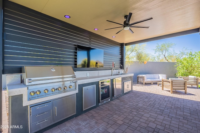 33766 N 86th St, Scottsdale, AZ 85266 - view of patio / terrace with a grill, an outdoor hangout area, an outdoor kitchen, ceiling fan, and beverage cooler