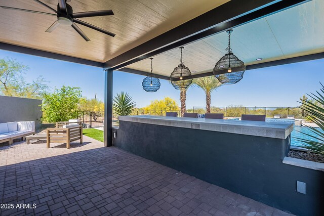 33766 N 86th St, Scottsdale, AZ 85266 - view of patio / terrace with fence, an outdoor living space, ceiling fan, and exterior bar