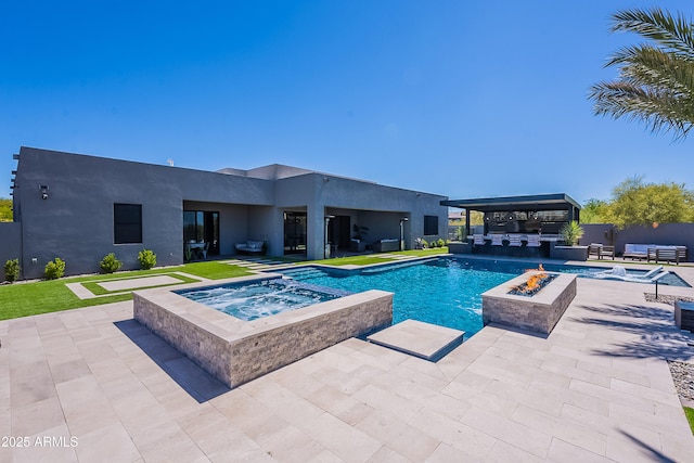 33766 N 86th St, Scottsdale, AZ 85266 - view of pool featuring a pool with connected hot tub, area for grilling, a patio area, and an outdoor living space with a fire pit