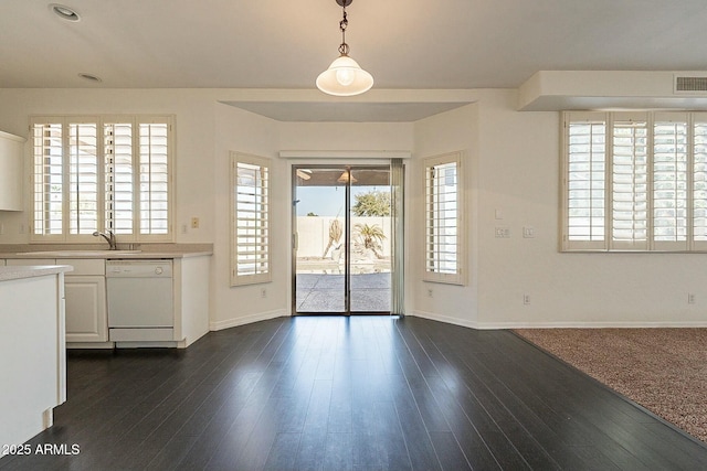 entrance foyer with dark hardwood / wood-style flooring and sink