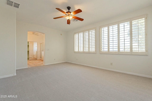 carpeted empty room featuring ceiling fan