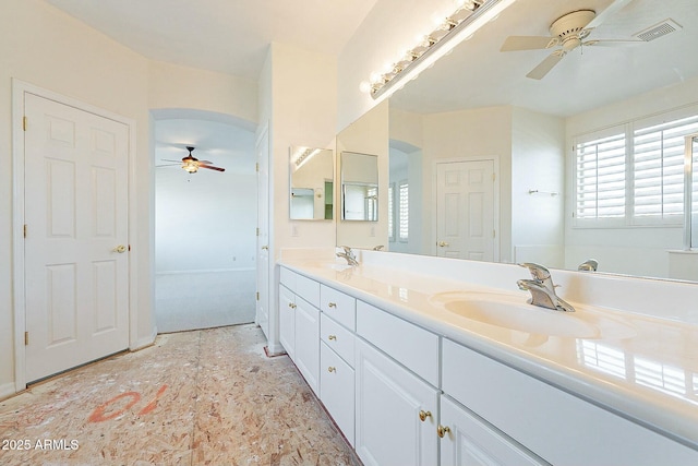 bathroom with ceiling fan and vanity