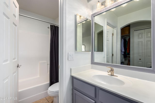 full bathroom with shower / bath combination with curtain, toilet, tile flooring, and oversized vanity