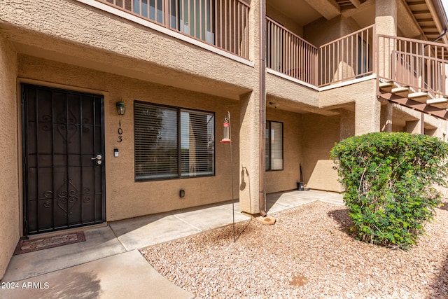 property entrance with a balcony