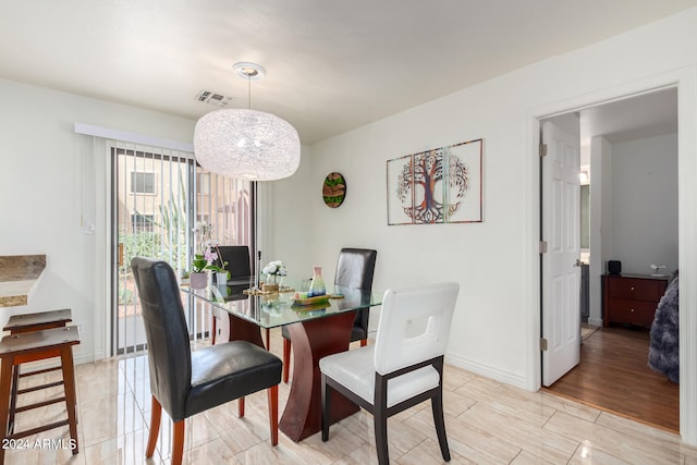 dining space with light wood-type flooring