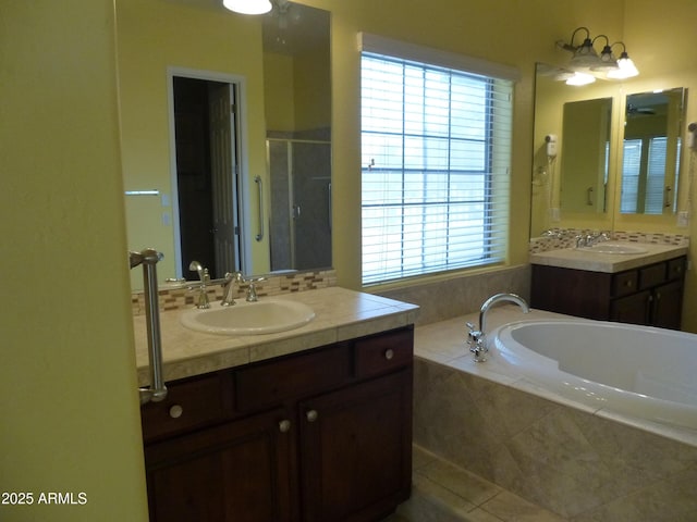 6687 S Banning St, Gilbert, AZ 85298 - full bath featuring a bath, two vanities, and healthy amount of natural light