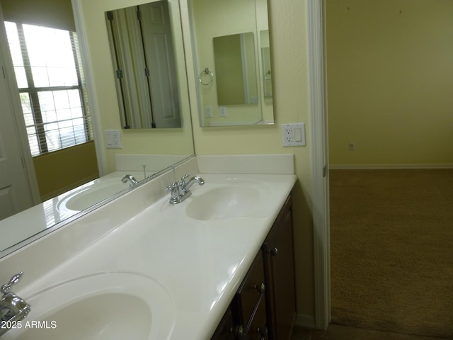 6687 S Banning St, Gilbert, AZ 85298 - full bathroom featuring double vanity and baseboards