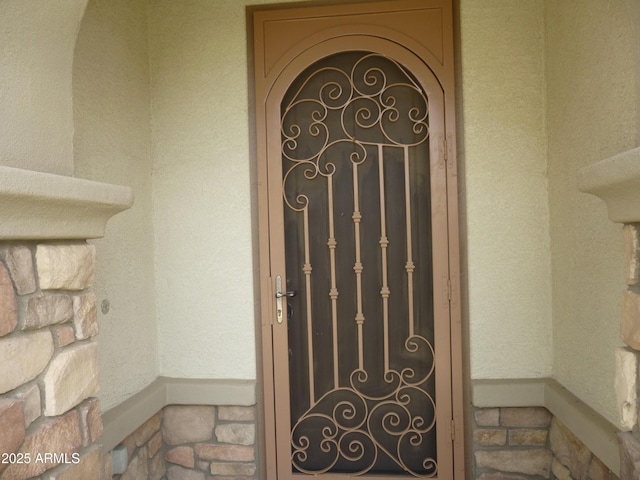 6687 S Banning St, Gilbert, AZ 85298 - view of exterior entry featuring stone siding