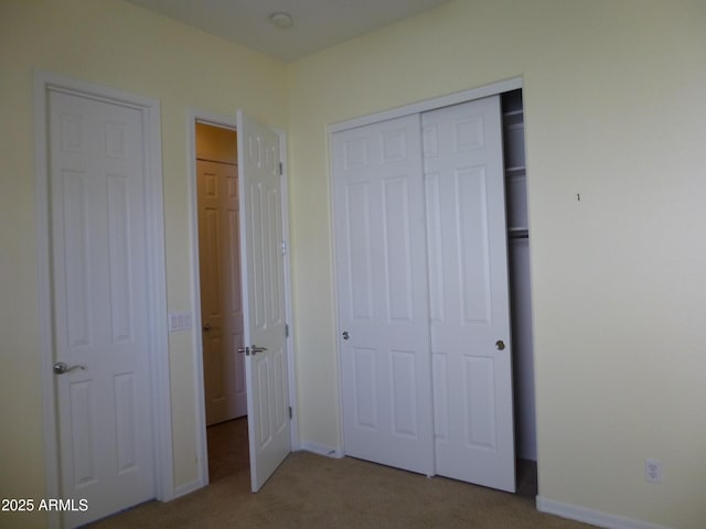6687 S Banning St, Gilbert, AZ 85298 - unfurnished bedroom featuring carpet flooring, baseboards, and a closet