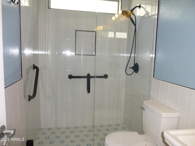6687 S Banning St, Gilbert, AZ 85298 - bathroom featuring toilet, a stall shower, and tile walls