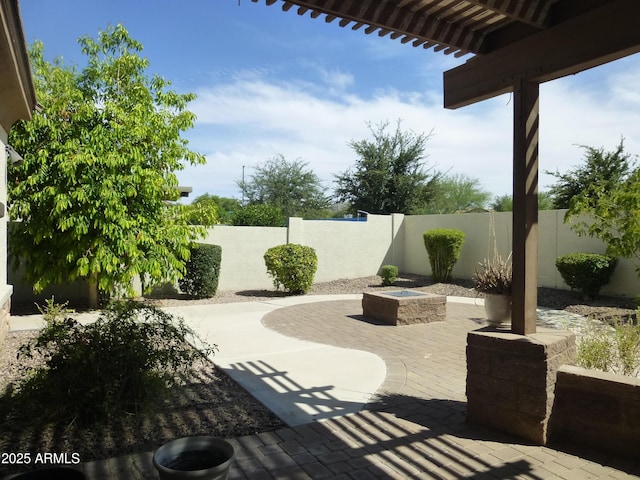 6687 S Banning St, Gilbert, AZ 85298 - fenced backyard with a patio area, an outdoor fire pit, and a pergola