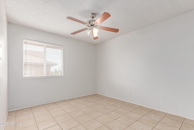 spare room featuring a textured ceiling and ceiling fan
