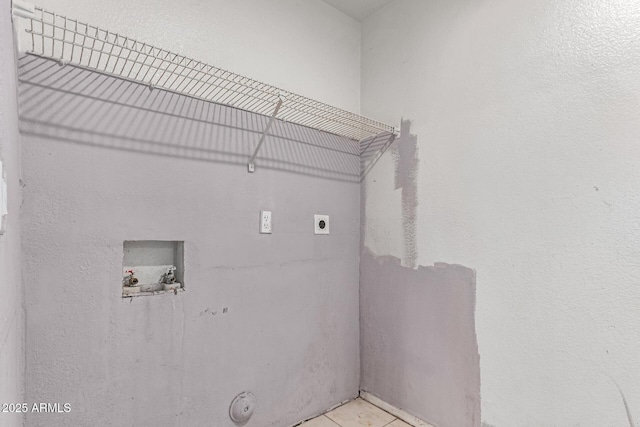 washroom with hookup for an electric dryer, washer hookup, and tile patterned flooring