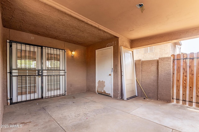 view of patio / terrace featuring fence