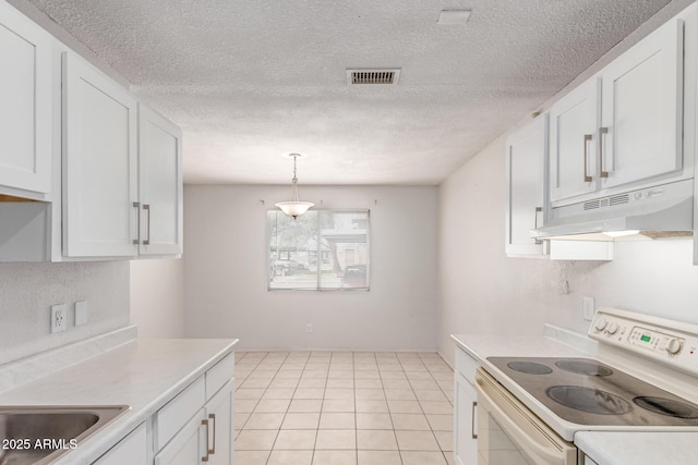 kitchen featuring electric stove, under cabinet range hood, light countertops, white cabinetry, and a textured ceiling