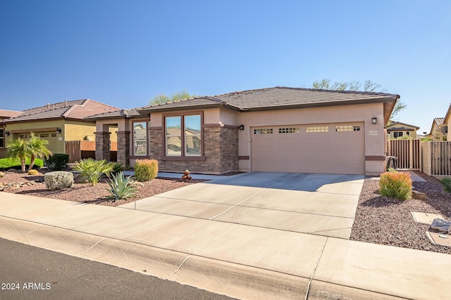 prairie-style home featuring a garage