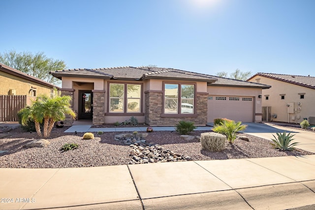 prairie-style home featuring a garage