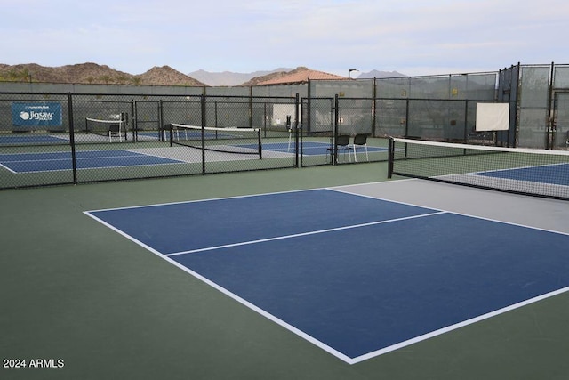 view of tennis court with a mountain view and basketball court