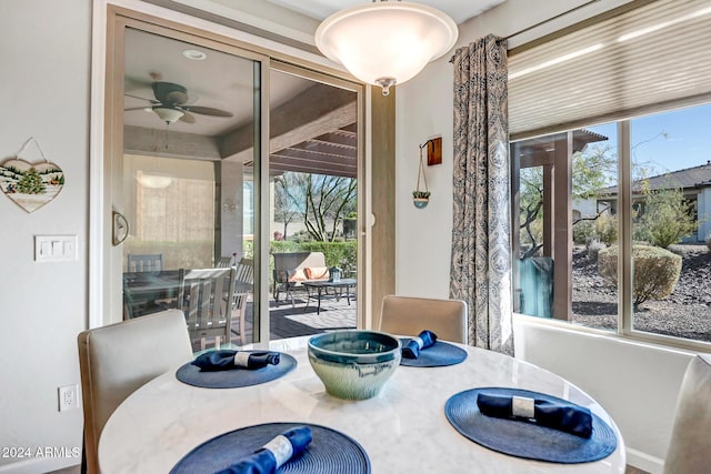 dining space featuring ceiling fan