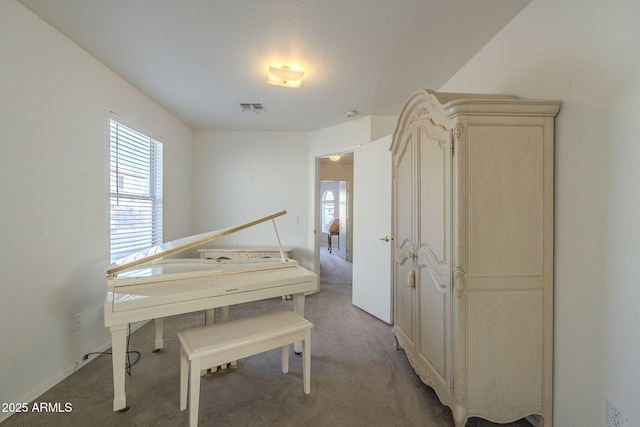 interior space featuring visible vents, a wealth of natural light, and carpet flooring