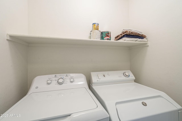 laundry area with laundry area and separate washer and dryer