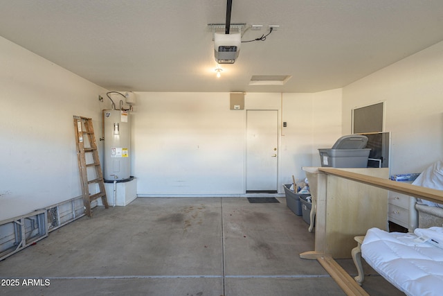 garage featuring water heater and a garage door opener