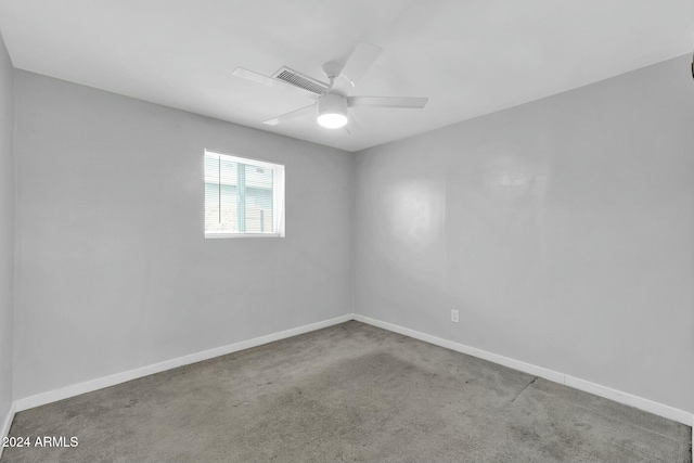 carpeted empty room with ceiling fan