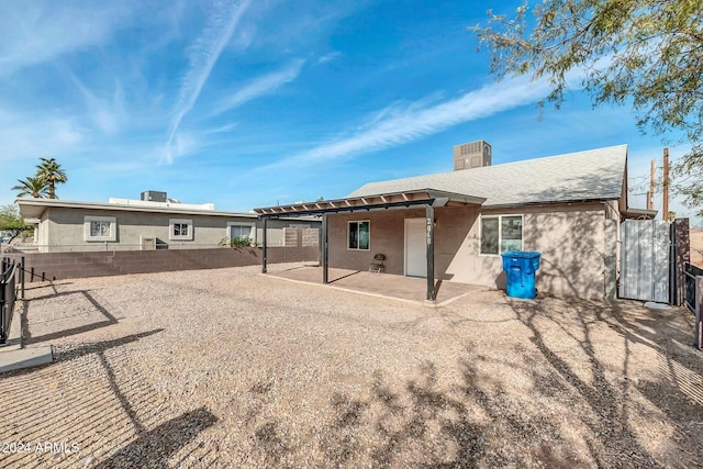 back of house with a patio area