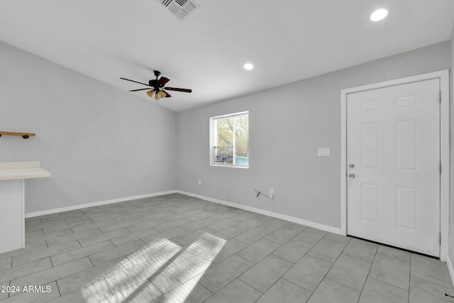 interior space with ceiling fan