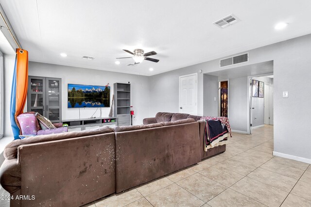 living room featuring ceiling fan and light tile patterned floors