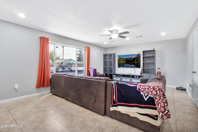 living room with light tile patterned floors and ceiling fan