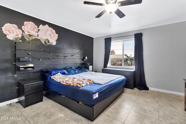 tiled bedroom featuring ceiling fan