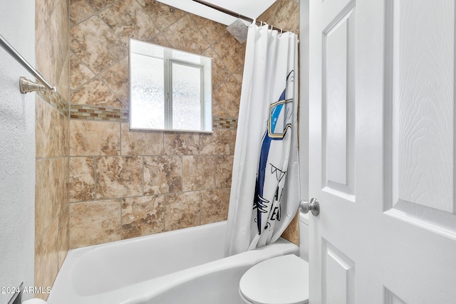 bathroom with shower / bath combination with curtain and toilet