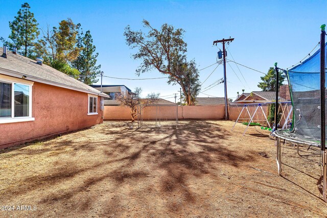 view of yard featuring a trampoline