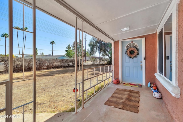 doorway to property with a porch