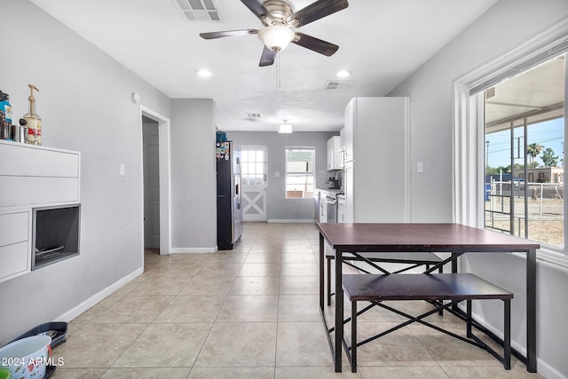 dining room featuring ceiling fan and light tile patterned floors