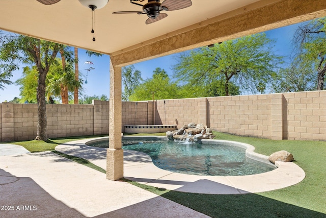 view of swimming pool with a fenced in pool, a fenced backyard, ceiling fan, and a patio