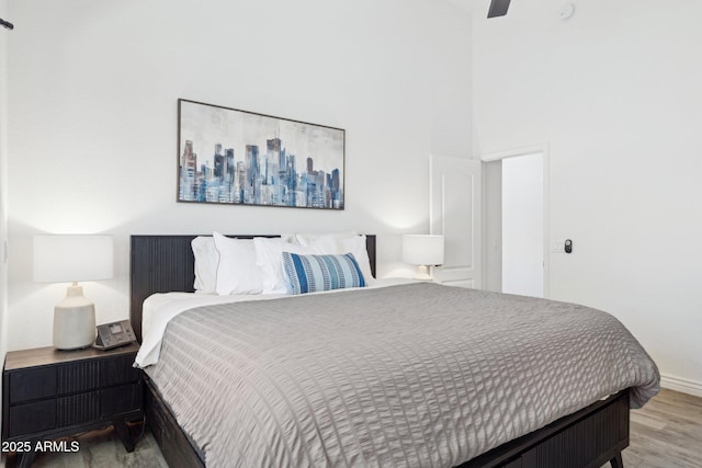 bedroom featuring a ceiling fan and wood finished floors