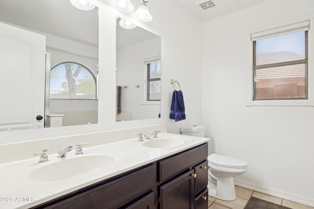 full bathroom featuring visible vents, a sink, tile patterned flooring, and toilet
