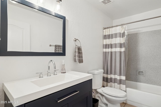 bathroom featuring vanity, shower / bath combo, toilet, and visible vents