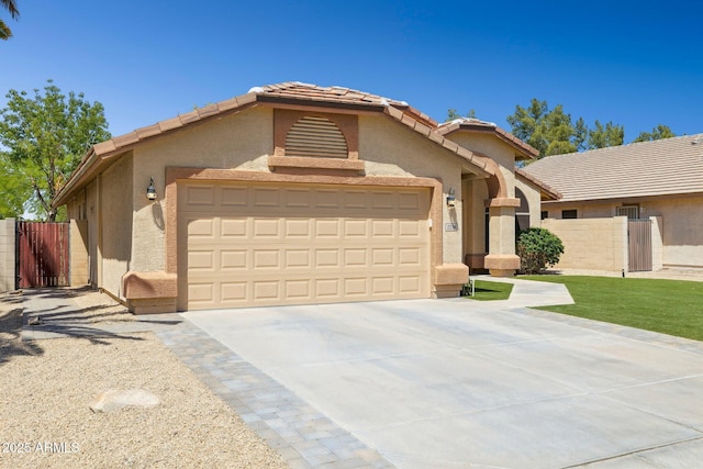 ranch-style house featuring stucco siding, a garage, fence, and driveway
